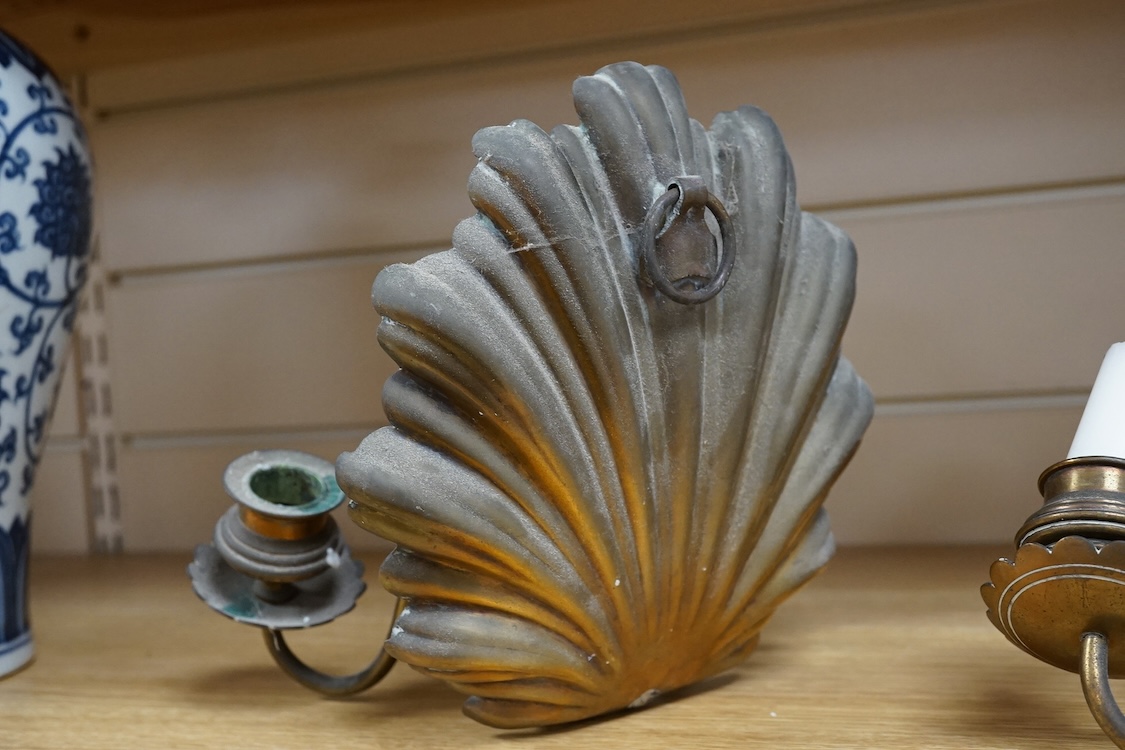 A pair of brass twin branch wall lights with scallop shell backs, 26cm high